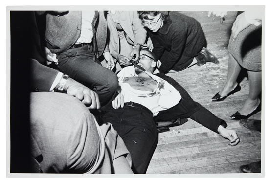 MALCOLM X. Group of six gelatin silver print photographs of Malcolm Xs Assassination;